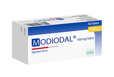 Modafinil içeren tablet: MODIODAL 100 MG 30 TABLET ambalajı. Üretici: TEVA İLAÇLARI SANAYİ VE TİCARET A.Ş.