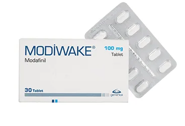 MODIWAKE 100 MG 30 TABLET ambalajı, tablet formunda modafinil içerir. Üretici: GENVEON İLAÇ SANAYİ VE TİCARET ANONİM ŞİRKETİ.