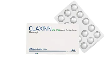 Olanzapin içeren tablet: OLAXINN 20 MG AGIZDA DAGILAN 28 TABLET ambalajı. Üretici: GENVEON İLAÇ SANAYİ VE TİCARET ANONİM ŞİRKETİ.